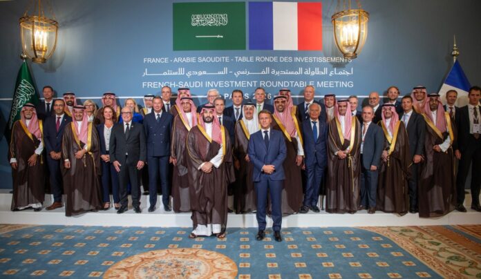 Saudi and French officials, including Crown Prince Mohammed bin Salman and President Emmanuel Macron, at the French-Saudi Investment Roundtable Meeting in Paris.