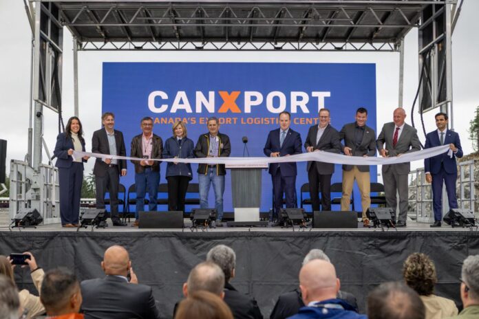 Officials and project partners cut the ribbon at the opening ceremony of the CANXPORT logistics hub at the Port of Prince Rupert.