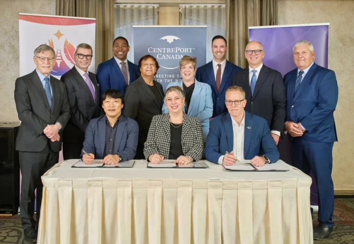 (Left to Right) MP Terry Duguid, MP Doug Eyolfson, Manitoba Minister Jamie Moses, Churchill Mayor Michael Spence, Manitoba Minister Lisa Naylor, MP Ben Carr, Winnipeg Mayor Scott Gillingham and Rosser Reeve Ken Mulligan. Sitting (L-R): Chris Avery, Carly Edmundson and Scott Weston.
